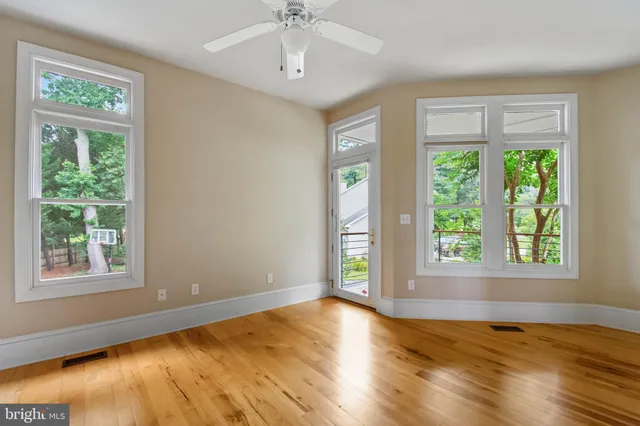 a view of a balcony with wooden floor