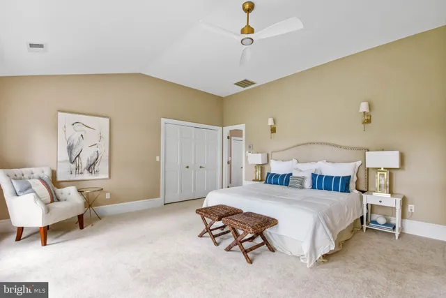 a bedroom with a bed and a couch