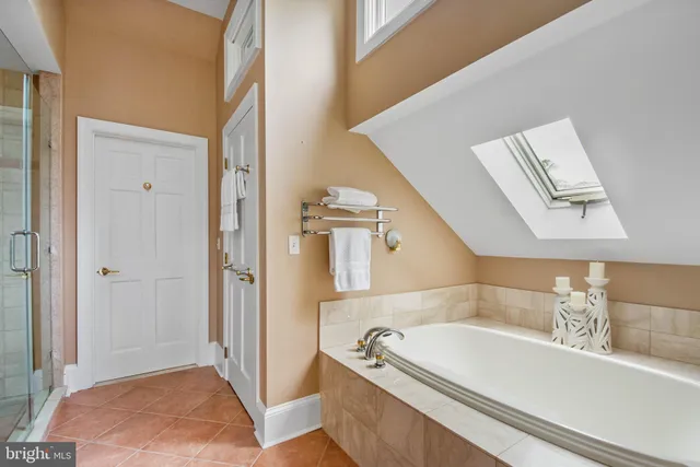 a view of walk in closet with living room