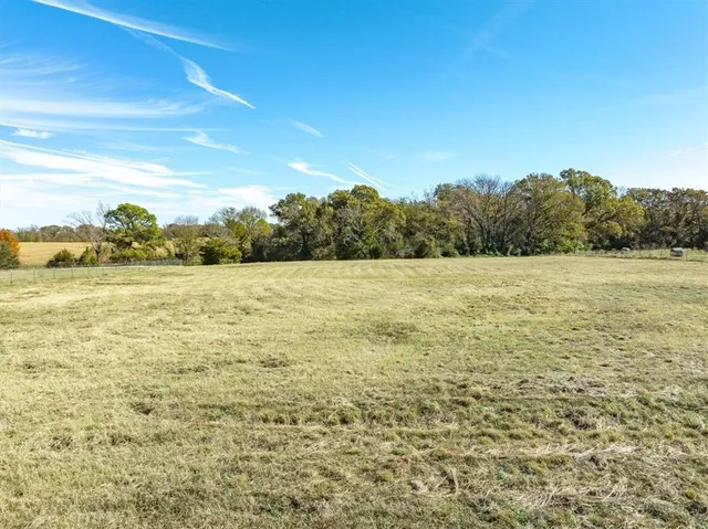 a view of a golf course with a lake