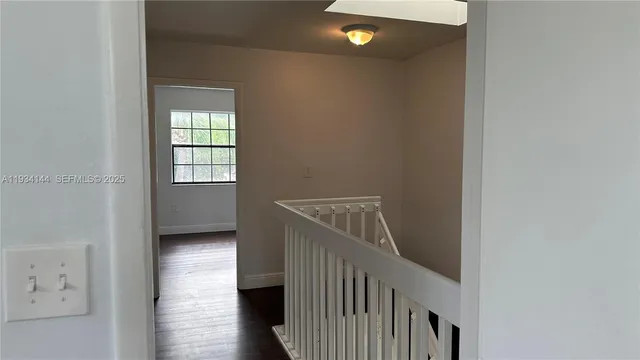 a view of entryway with wooden floor