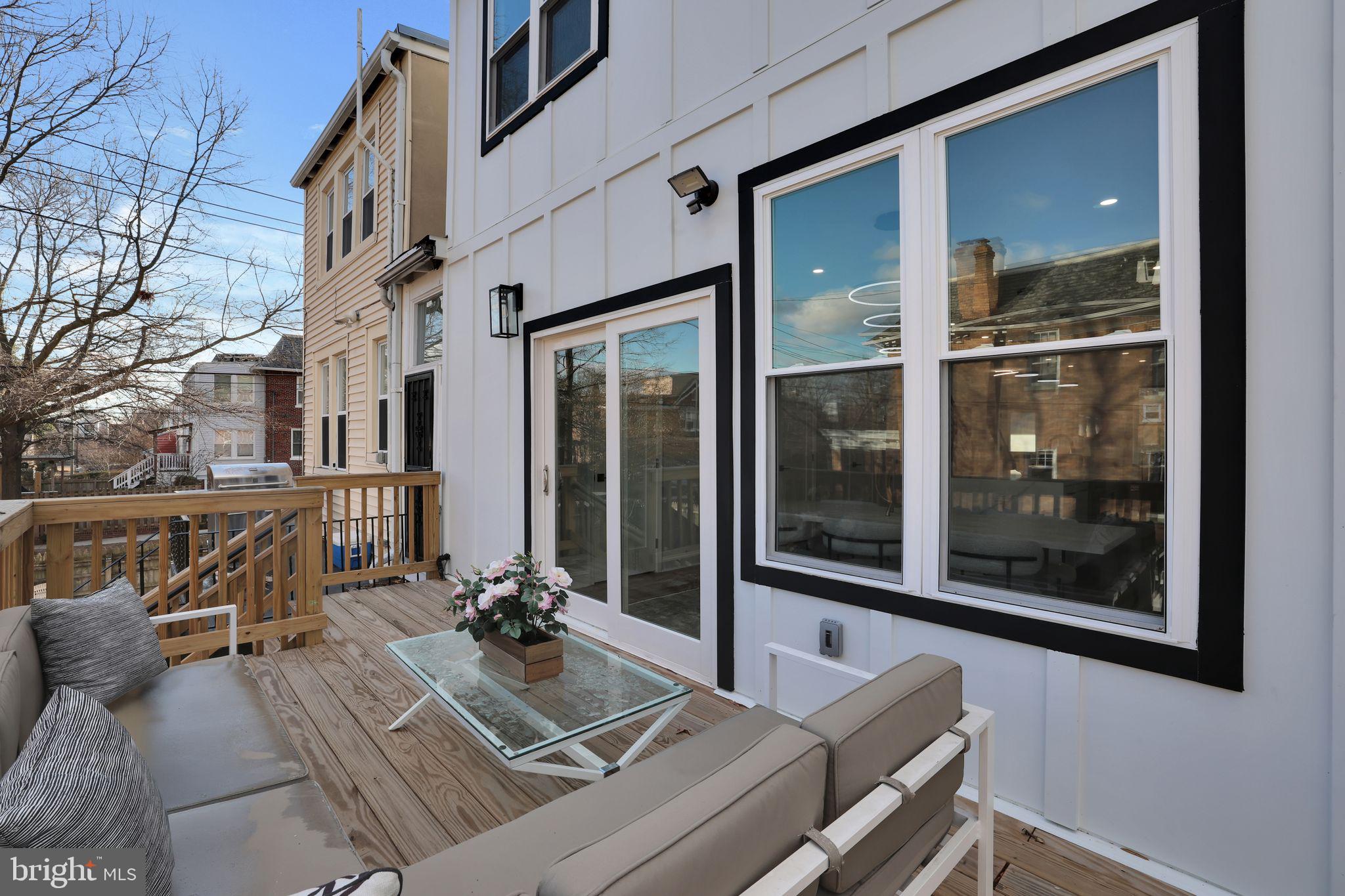5803 5th Street Northwest Washington, DC 20011 - Photo 51 of 57 a view of a balcony with chairs and floor to ceiling window