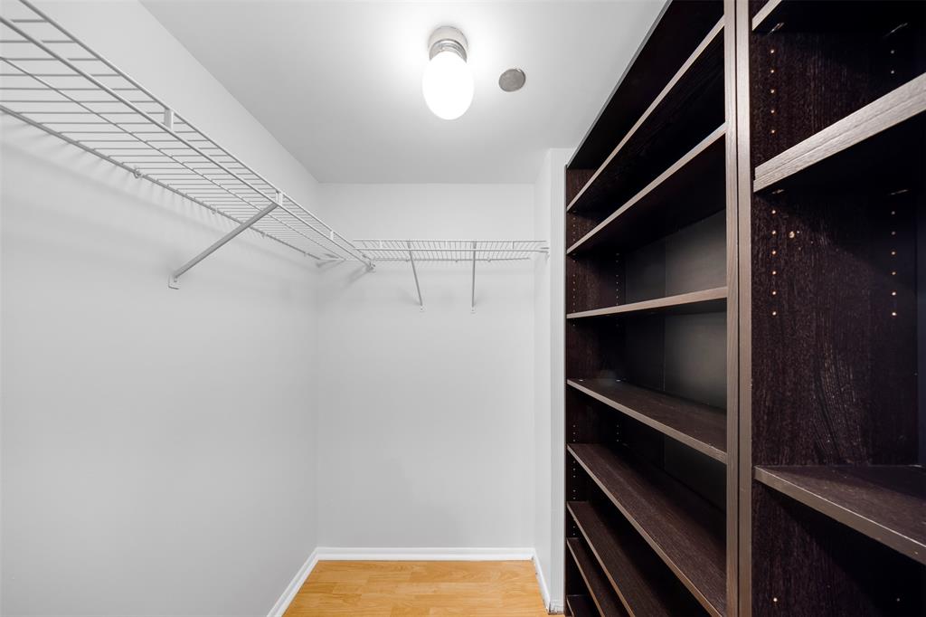 3520 Oaks Way, Unit 406 Pompano Beach, FL 33069 - Photo 26 of 32 a view of walk in closet with empty racks