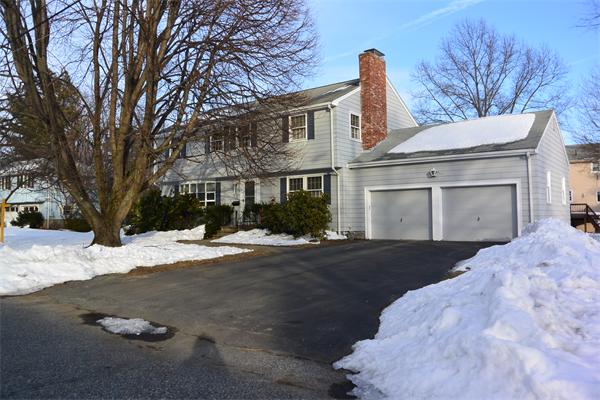 6 Hancock Road Needham, MA 02492 - Photo 19 of 19 a front view of a house with a yard and garage
