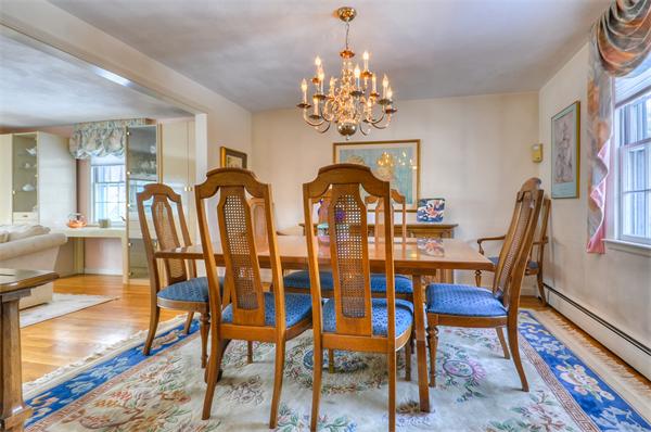 6 Hancock Road Needham, MA 02492 - Photo 5 of 19 a view of a dining room with furniture a chandelier and wooden floor