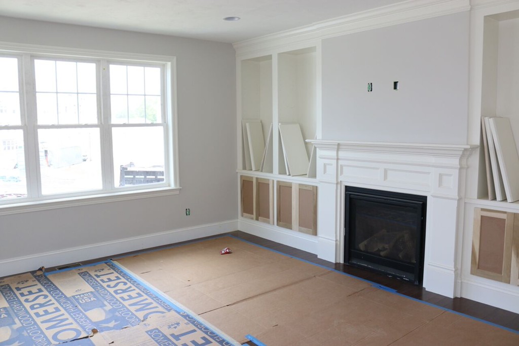 121 Oxbow Road Wayland, MA 01778 - Photo 3 of 3 a view of an empty room with a fireplace and a window