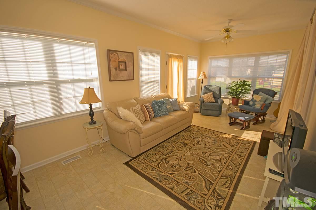 1012 Holland Ridge Drive Raleigh, NC 27603 - Photo 14 of 25 a living room with furniture and a large window