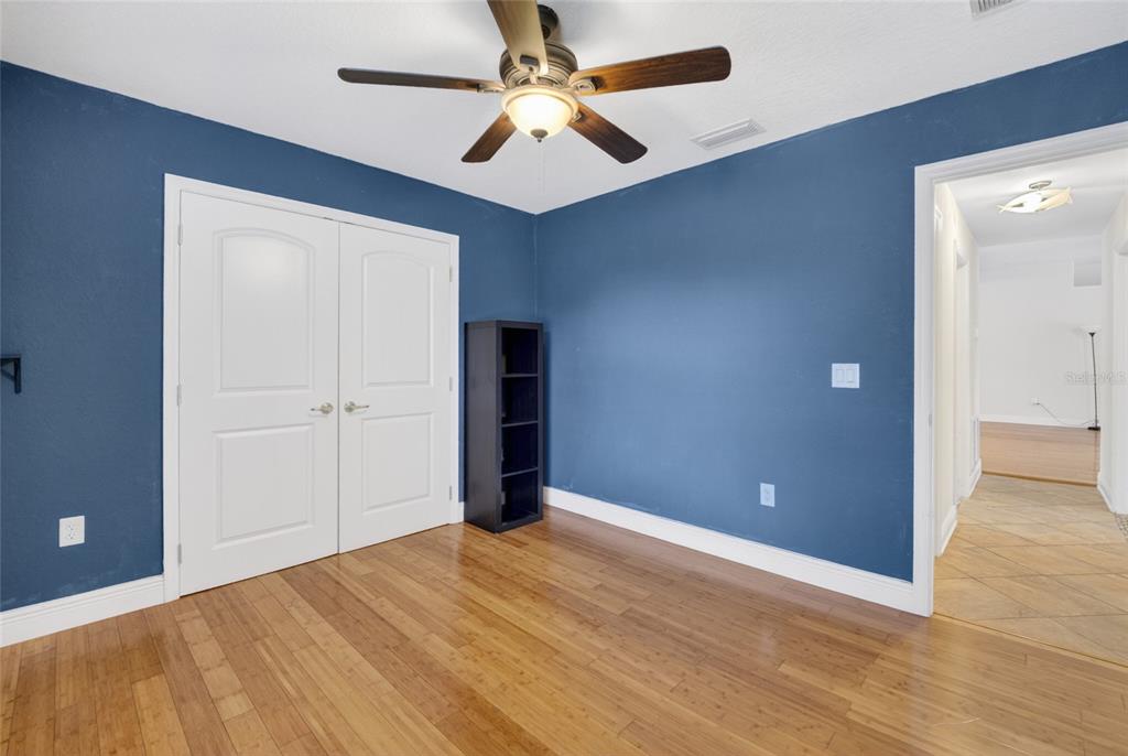 4319 Southwest 63rd Street Ocala, FL 34474 - Photo 21 of 29 an empty room with closet and a ceiling fan