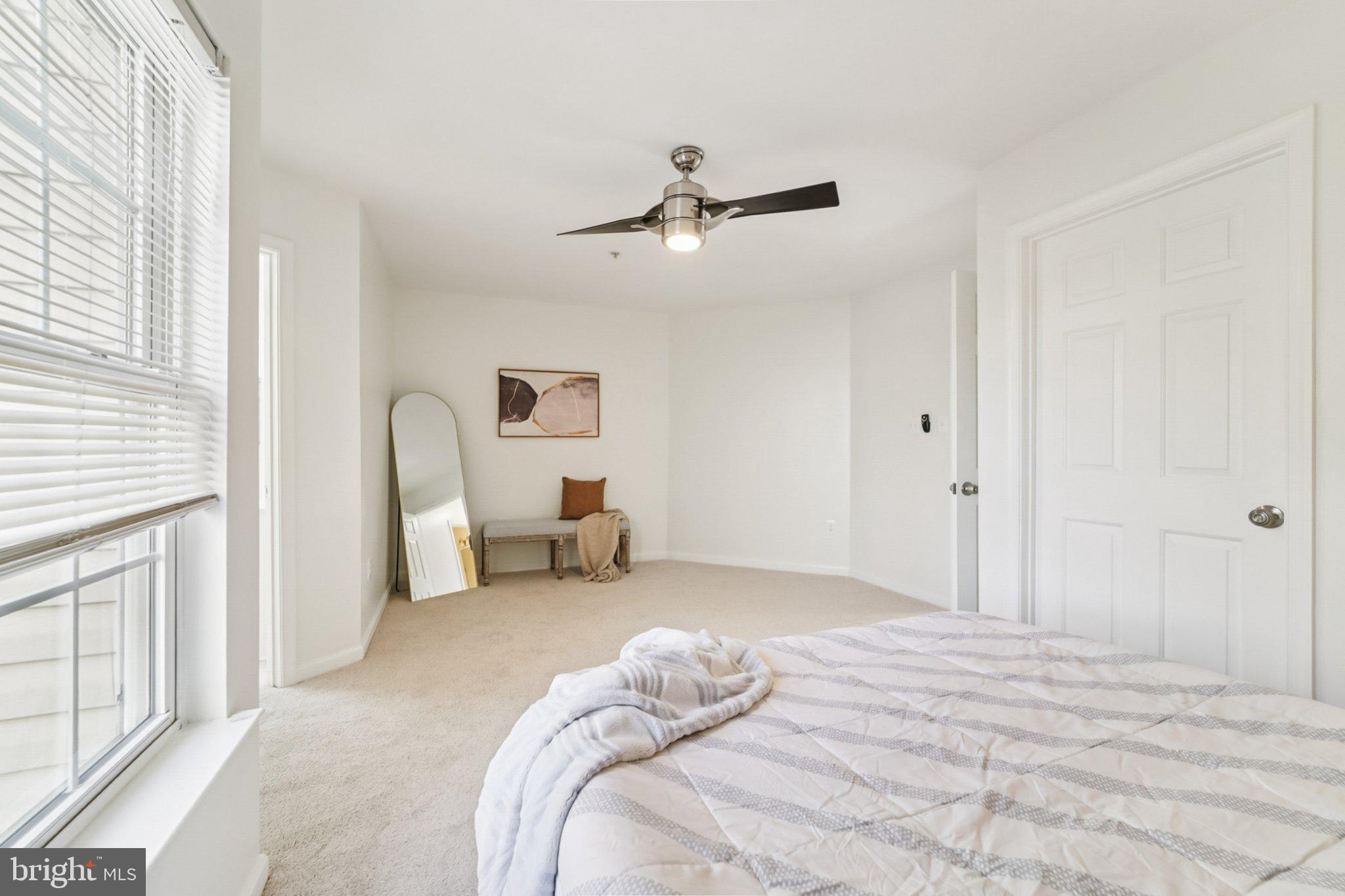 1007 Carbondale Way Crofton, MD 21114 - Photo 18 of 24 a bedroom with a bed a chandelier and closet