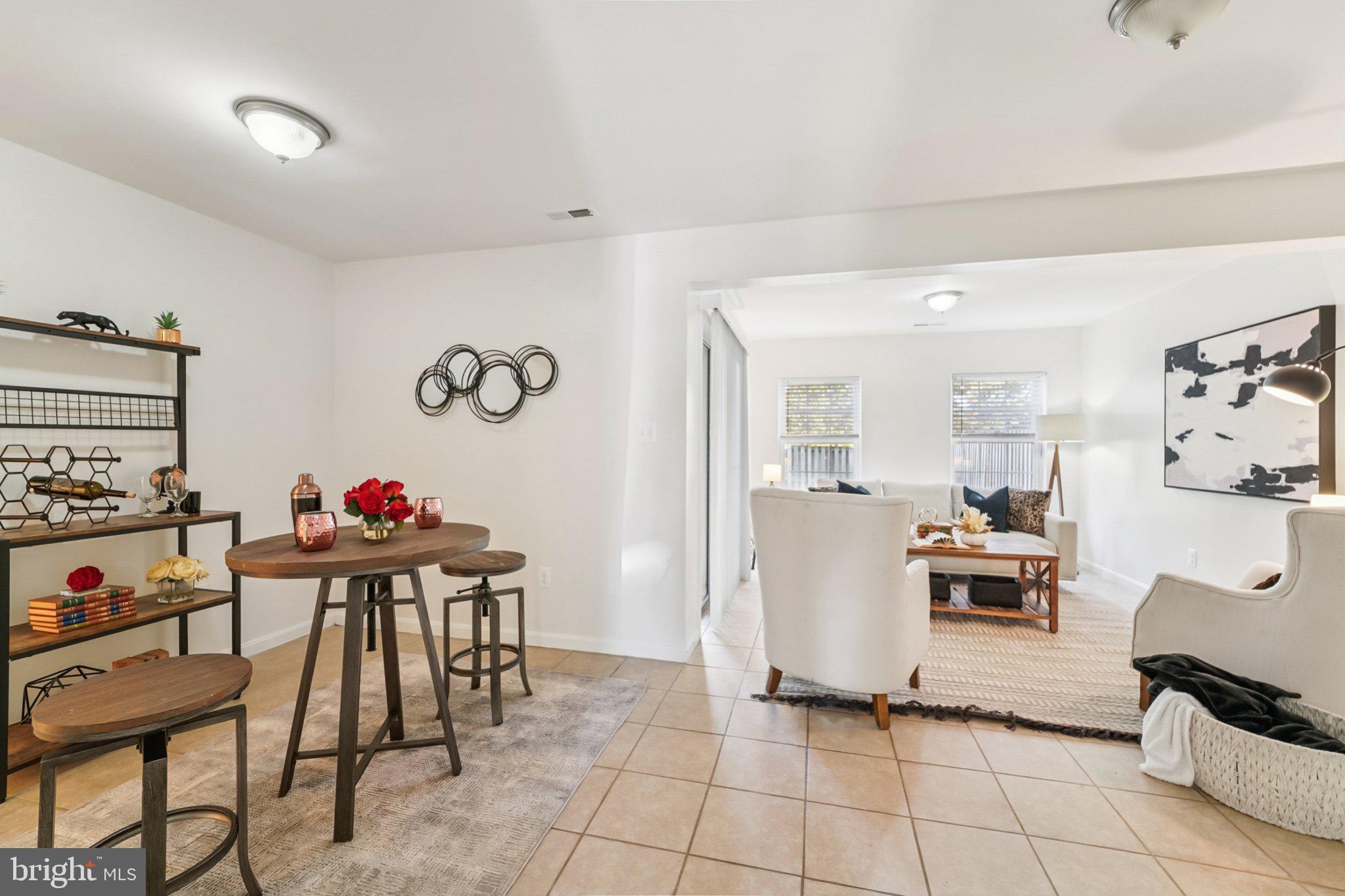 1007 Carbondale Way Crofton, MD 21114 - Photo 2 of 24 a view of a dining room with furniture and a kitchen