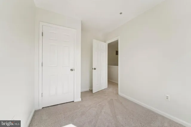 an aerial view of multiple houses with a yard