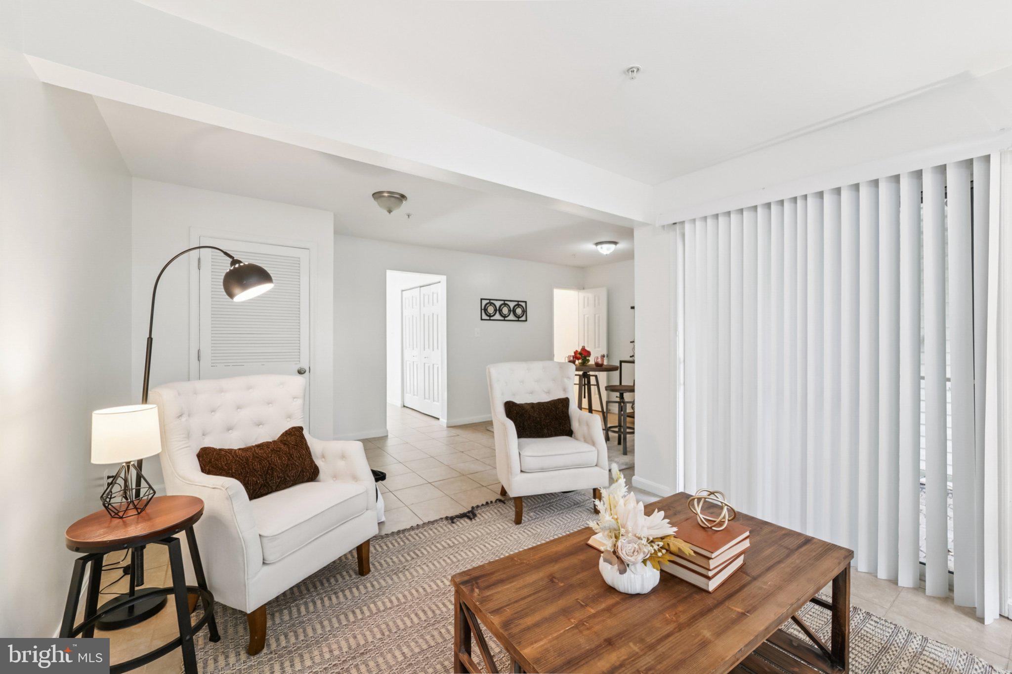 1007 Carbondale Way Crofton, MD 21114 - Photo 3 of 24 a living room with furniture and wooden floor