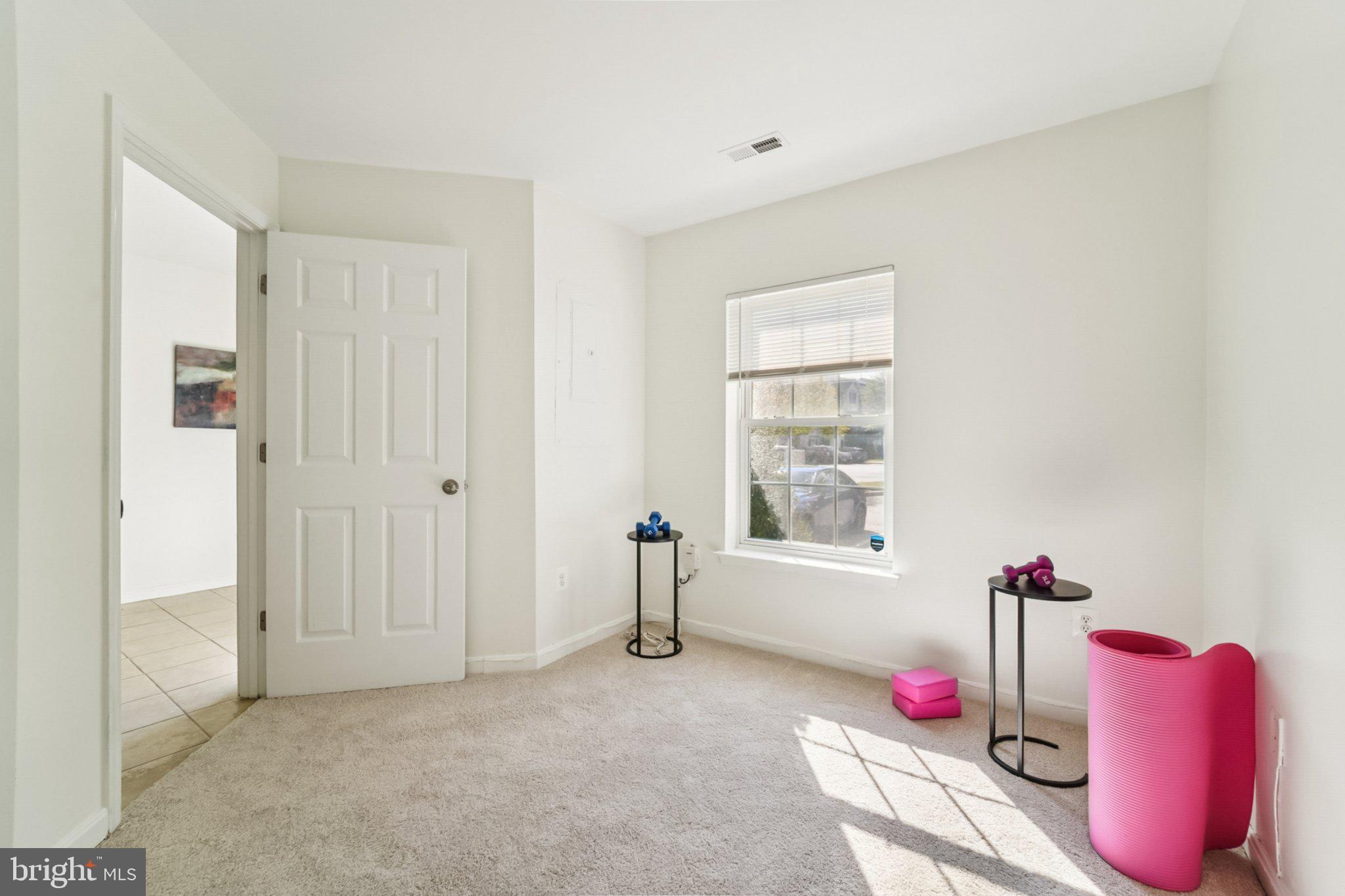 1007 Carbondale Way Crofton, MD 21114 - Photo 4 of 24 a bedroom with furniture and a window