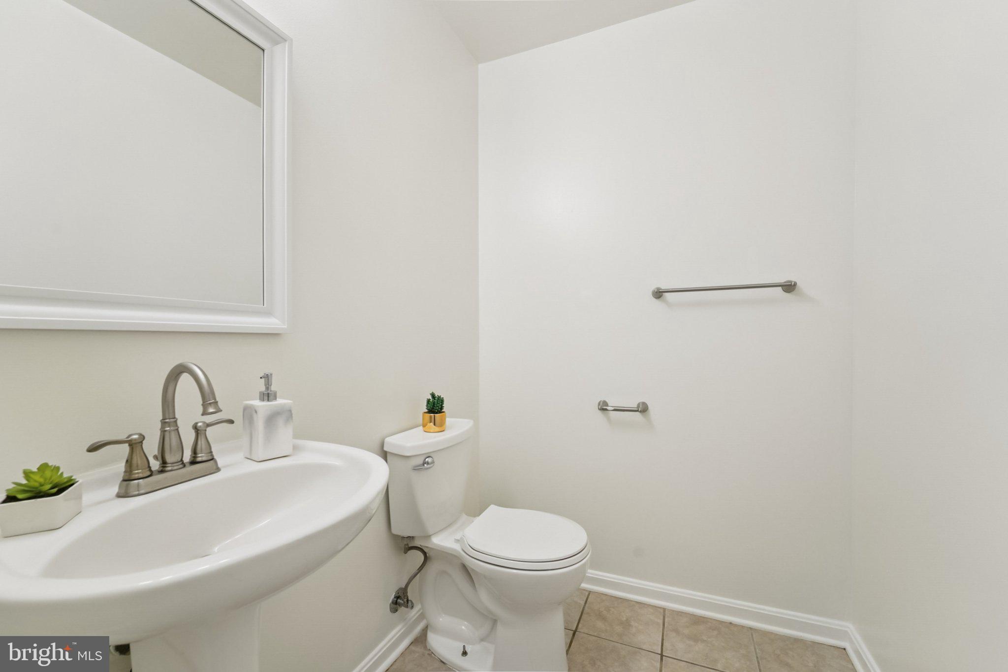 1007 Carbondale Way Crofton, MD 21114 - Photo 5 of 24 a bathroom with a sink toilet and a mirror