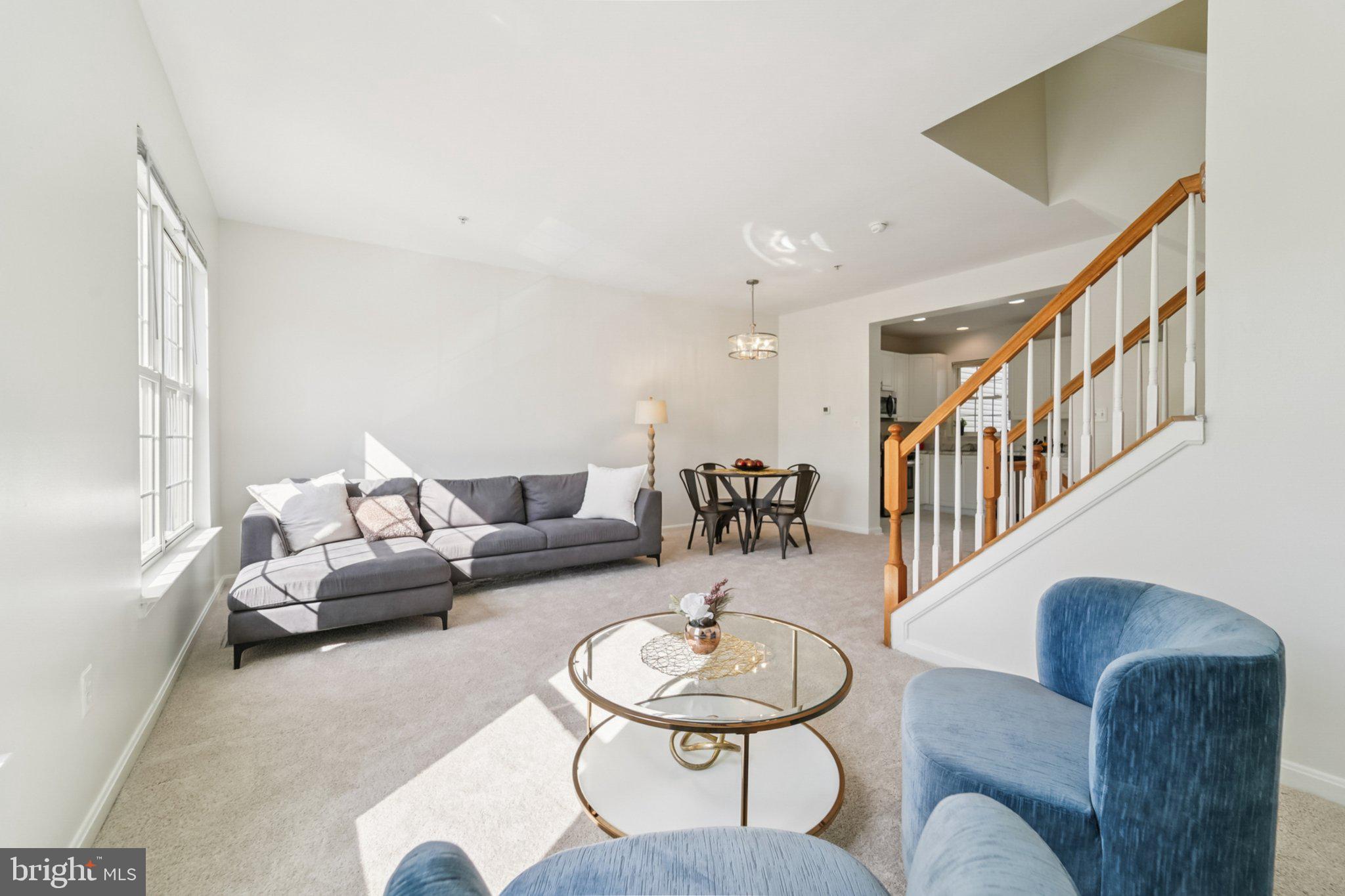 1007 Carbondale Way Crofton, MD 21114 - Photo 7 of 24 a living room with furniture and a dining table