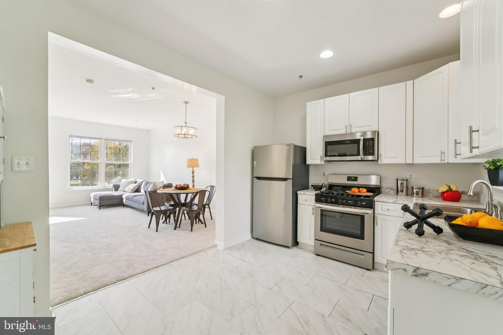 1007 Carbondale Way Crofton, MD 21114 - Photo 10 of 24 a view of kitchen with sink and refrigerator