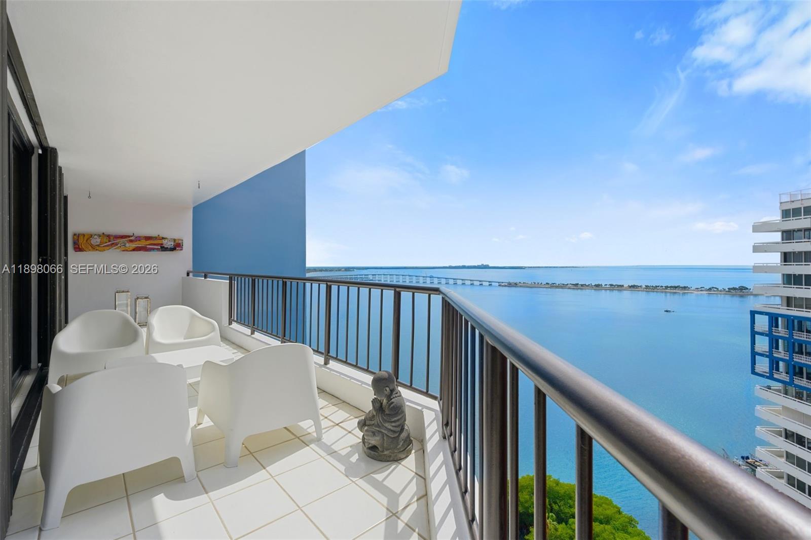 1581 Brickell Avenue, Unit 2005 Miami, FL 33129 - Photo 12 of 38 a balcony with table and chairs