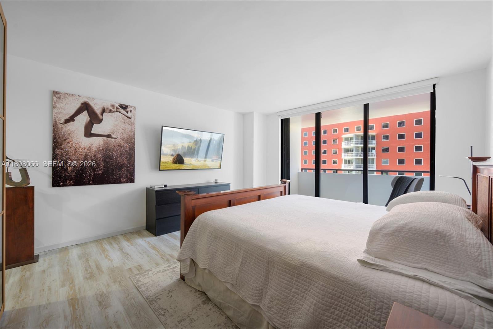 1581 Brickell Avenue, Unit 2005 Miami, FL 33129 - Photo 16 of 38 a bedroom with a large bed and a window