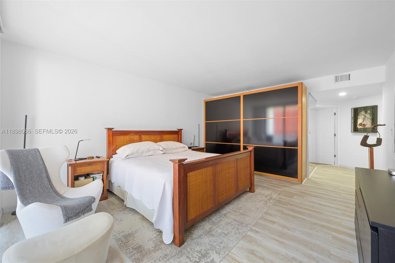 1581 Brickell Avenue, Unit 2005 Miami, FL 33129 - Photo 17 of 38 a bed room with a bed and a television