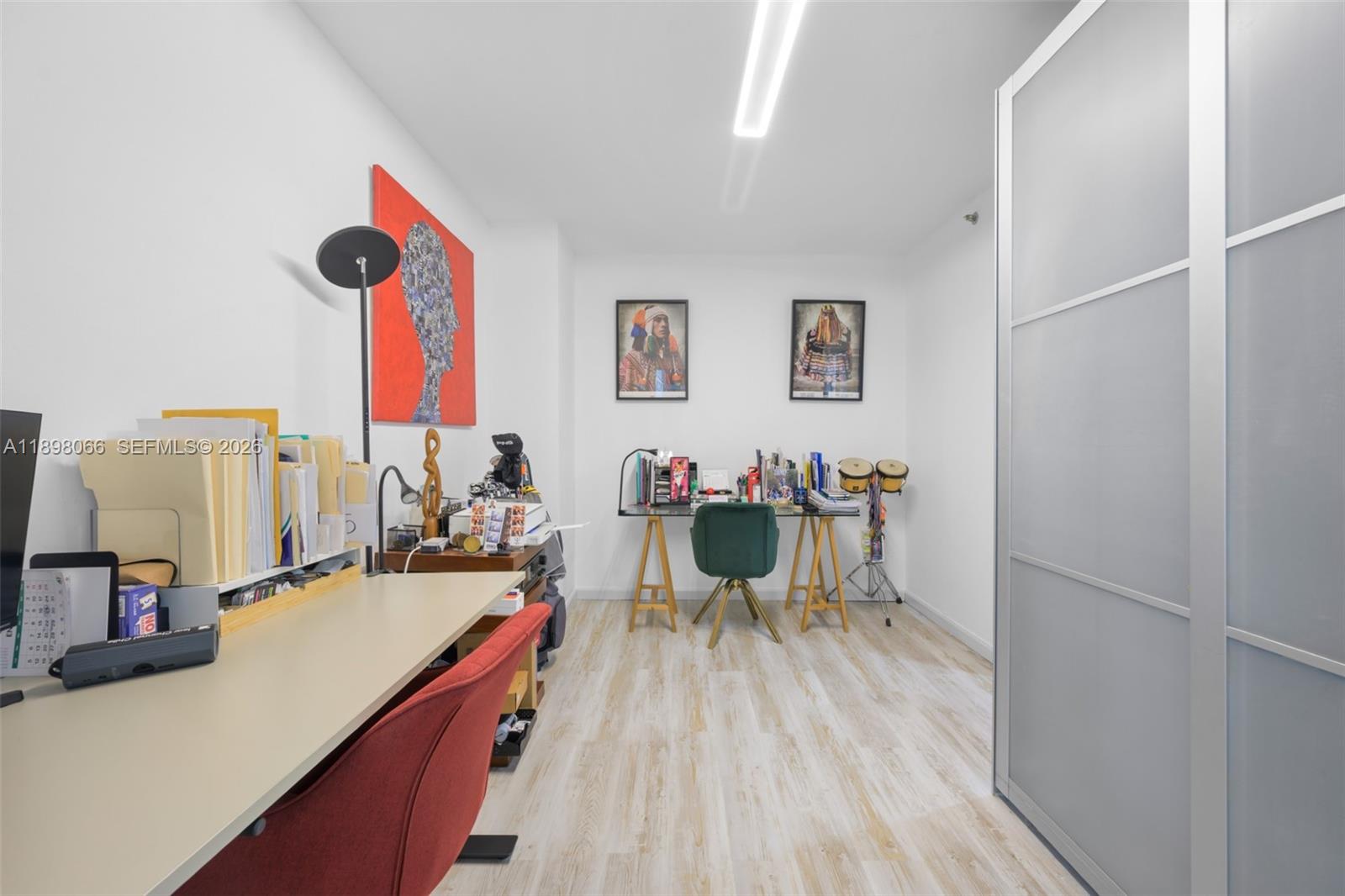 1581 Brickell Avenue, Unit 2005 Miami, FL 33129 - Photo 21 of 38 a view of a dining room with furniture and wooden floor