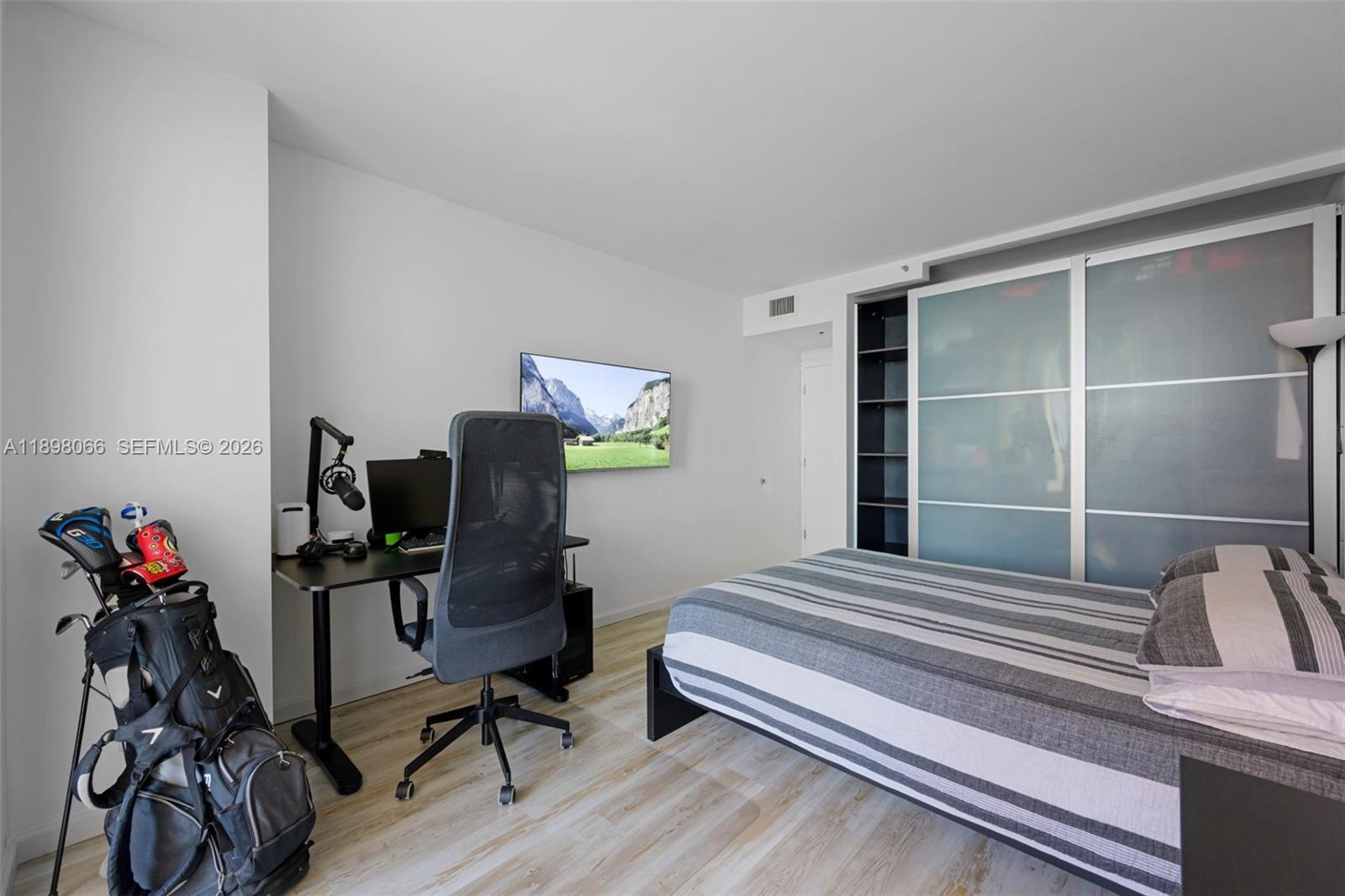 1581 Brickell Avenue, Unit 2005 Miami, FL 33129 - Photo 24 of 38 a bedroom with furniture and a window