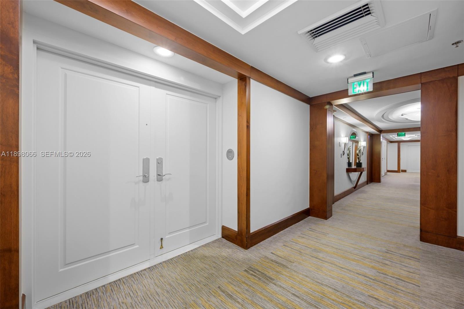 1581 Brickell Avenue, Unit 2005 Miami, FL 33129 - Photo 26 of 38 a view of hallway with wooden floor