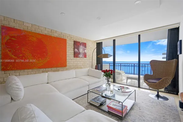 a living room with furniture a table and a flat screen tv