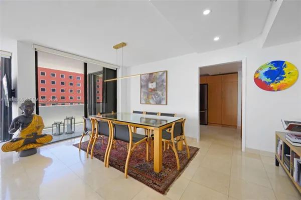a view of a large dining room with furniture window and wooden floor