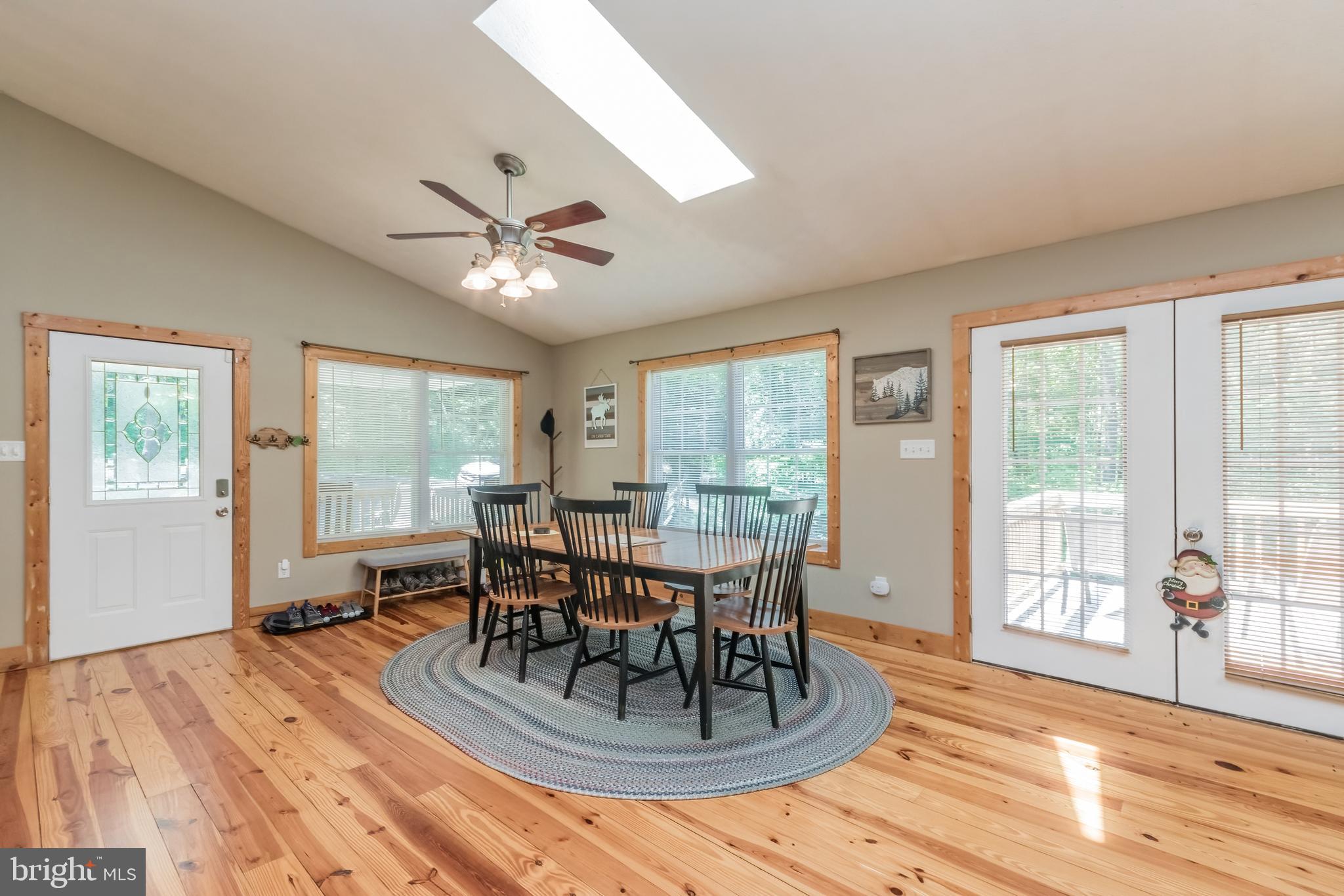 5630 Crooked Run Road Basye, VA 22810 - Photo 18 of 67 a dining room with furniture a chandelier and wooden floor