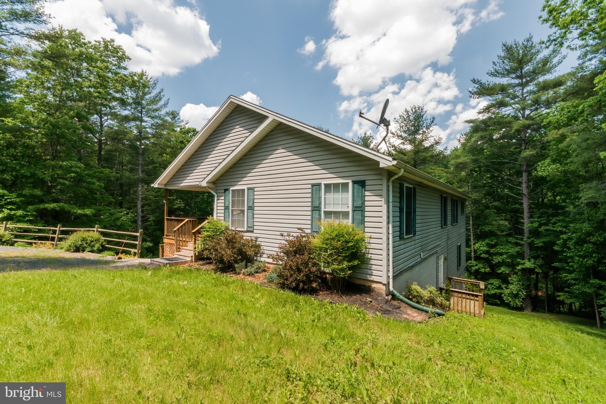 5630 Crooked Run Road Basye, VA 22810 - Photo 3 of 67 a front view of house with yard and green space