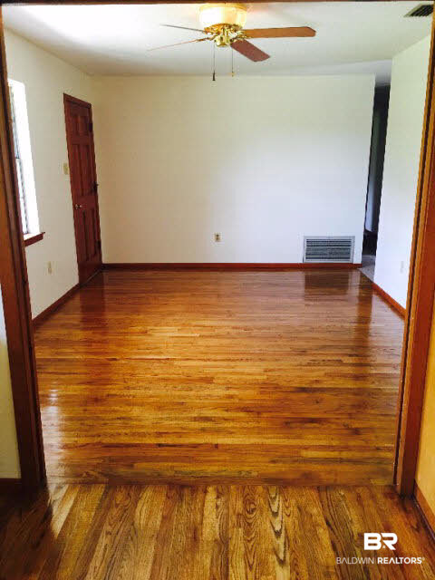 39660 Hannis Williams Road Bay Minette, AL 36507 - Photo 5 of 32 For Sale: 39660 Hannis Williams Road, Bay Minette, AL 36507 Dining Room with beautiful hardwood floors