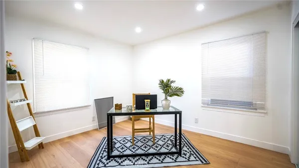 a workspace with furniture and window
