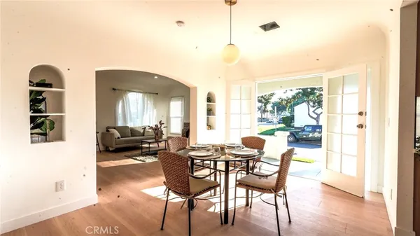 a view of a livingroom with furniture window and wooden floor