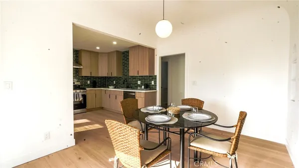 a kitchen with a table and chairs in it