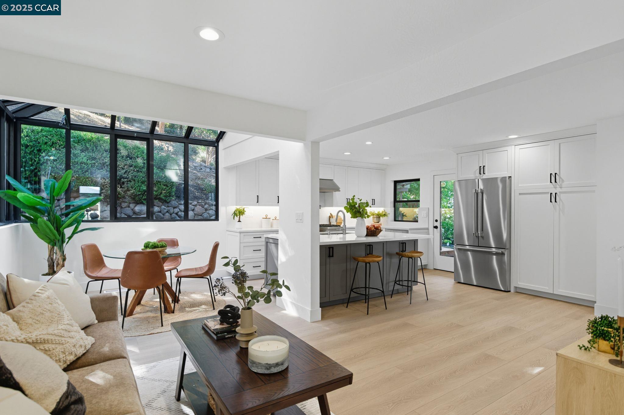 189 Rudgear Drive Walnut Creek, CA 94596 - Photo 11 of 59 a dining room with furniture kitchen view and a chandelier