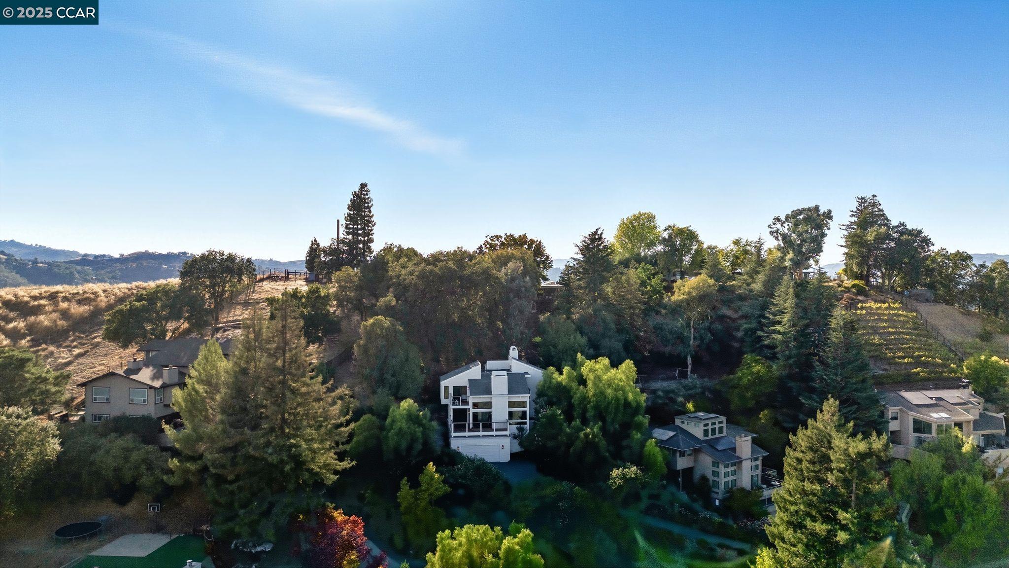 189 Rudgear Drive Walnut Creek, CA 94596 - Photo 18 of 59 a front view of a house with a yard and mountain view in back