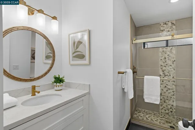 a view of a patio with table and chairs potted plants and large tree