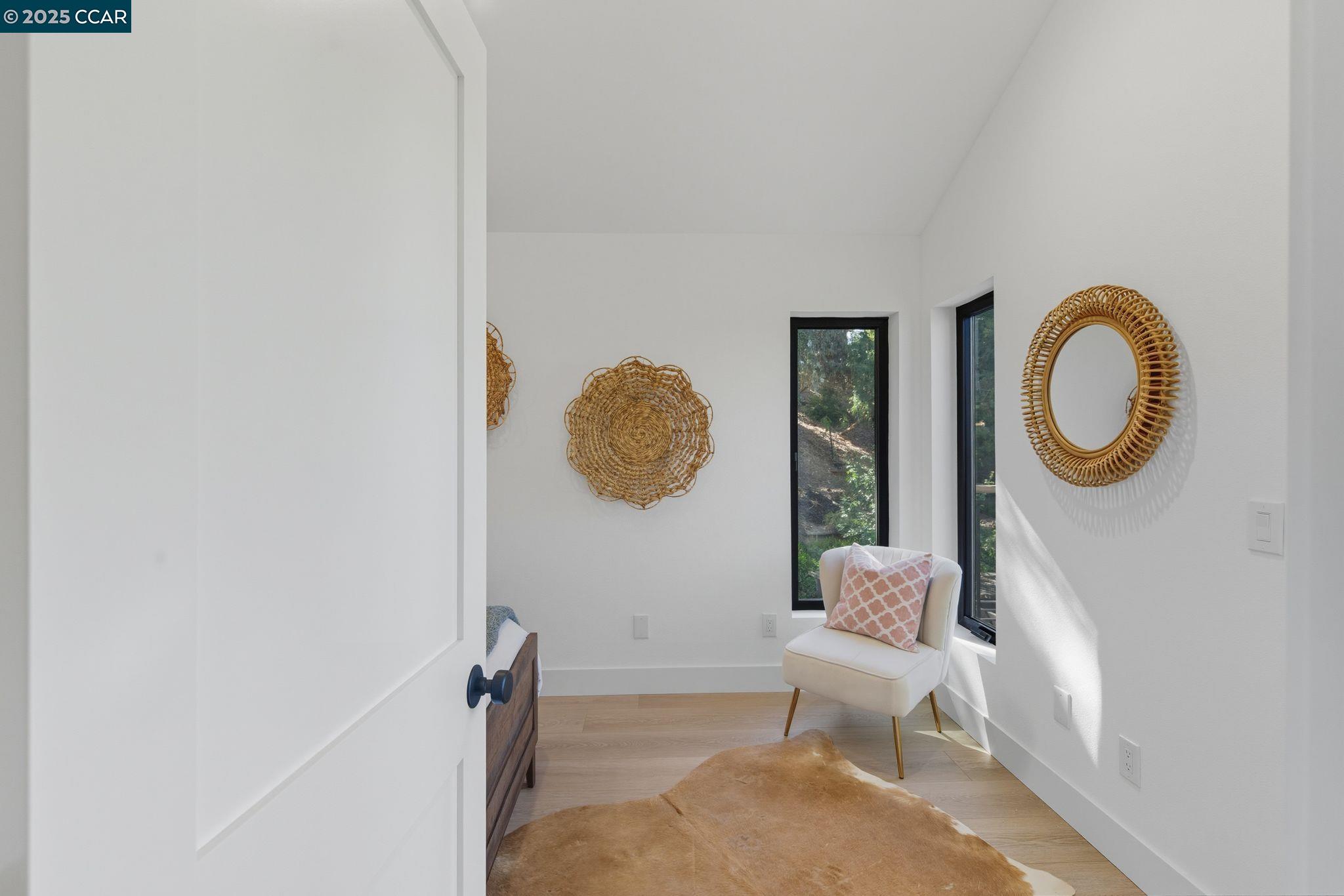 189 Rudgear Drive Walnut Creek, CA 94596 - Photo 25 of 59 a living room with a mirror furniture a rug and a window