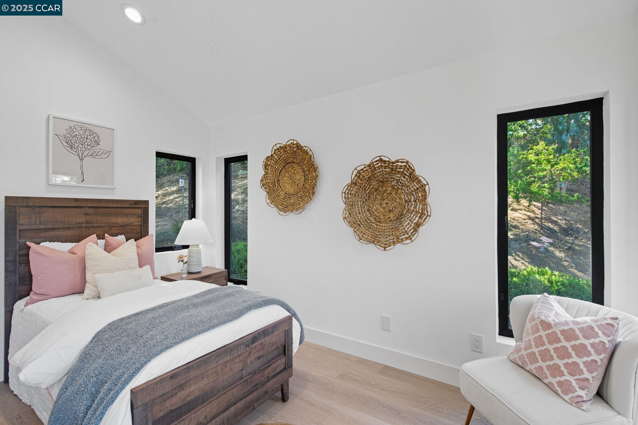 189 Rudgear Drive Walnut Creek, CA 94596 - Photo 26 of 59 a bedroom with a bed mirror and window