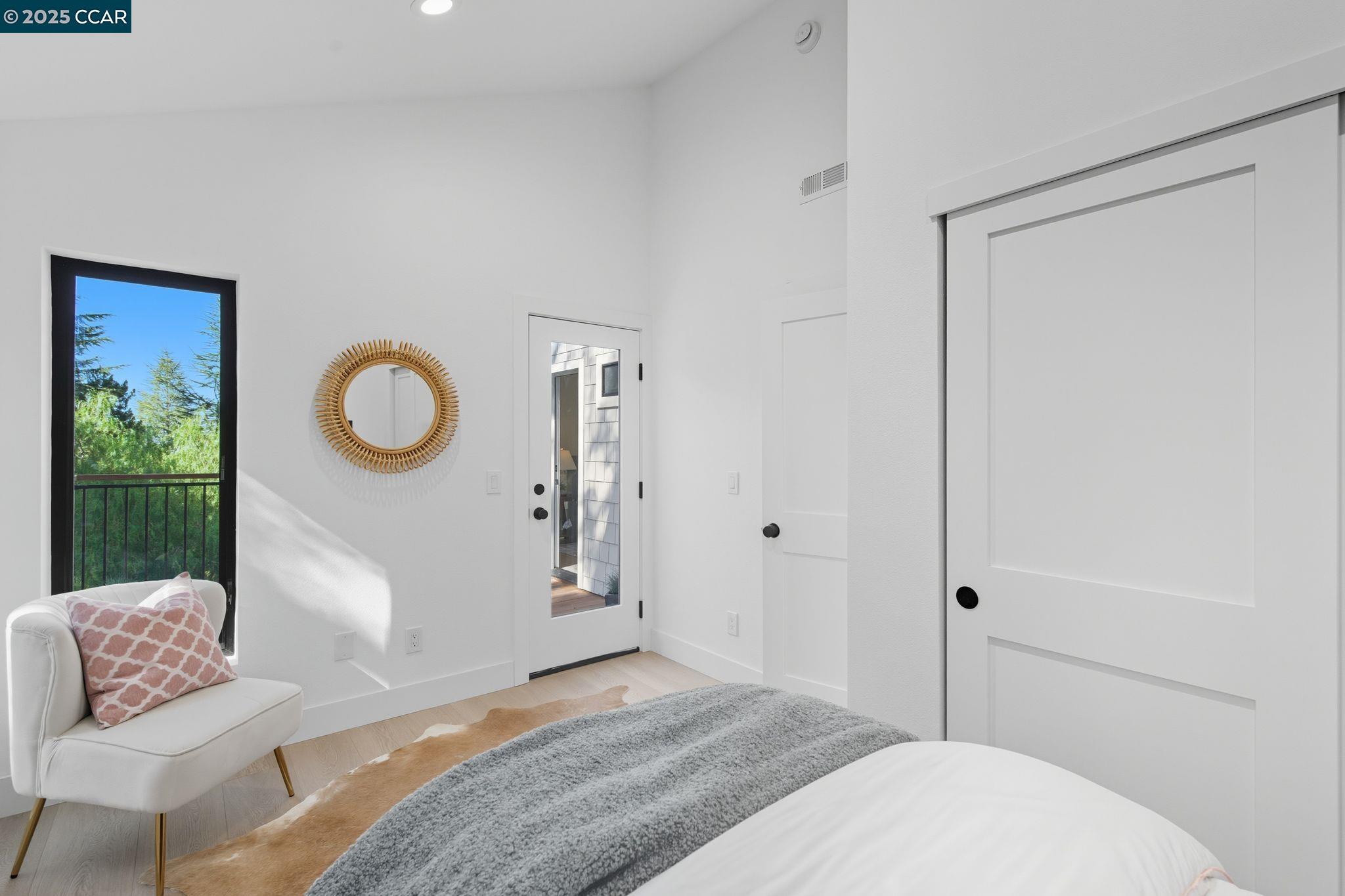 189 Rudgear Drive Walnut Creek, CA 94596 - Photo 29 of 59 a bedroom with a bed and a chair