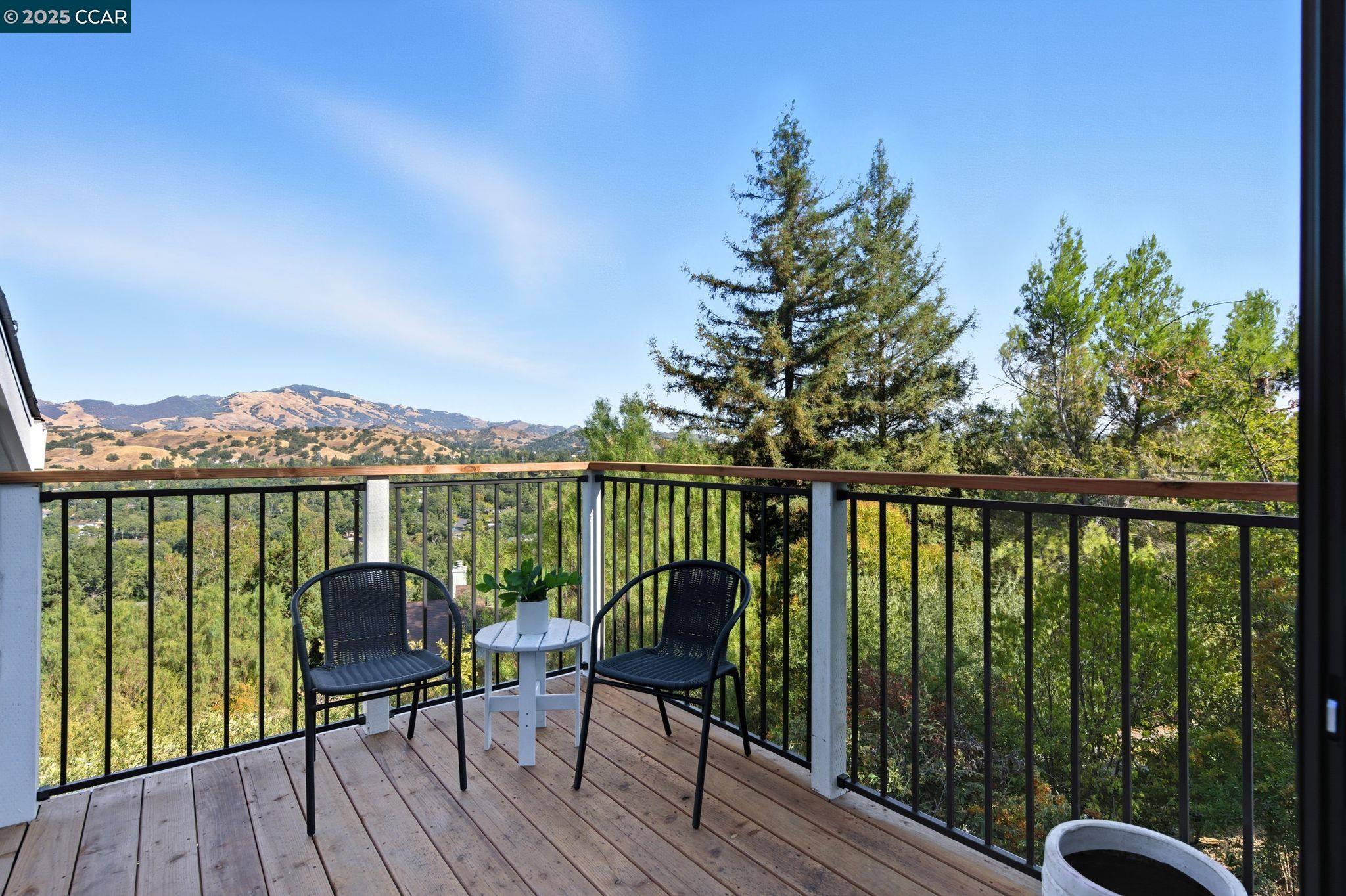 189 Rudgear Drive Walnut Creek, CA 94596 - Photo 33 of 59 a view of a balcony with chairs and wooden floor