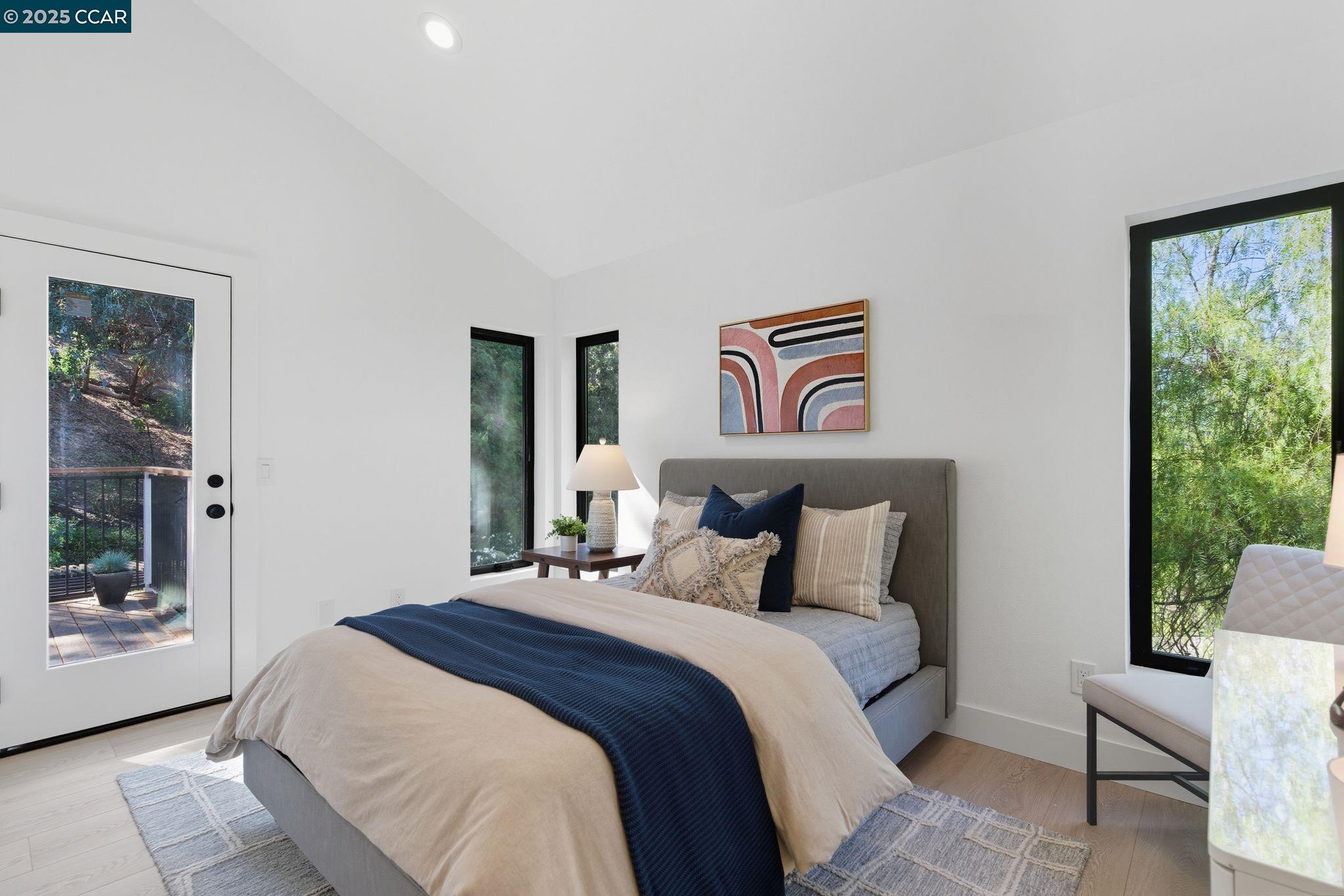 189 Rudgear Drive Walnut Creek, CA 94596 - Photo 50 of 59 a bedroom with a bed and a painting on the wall