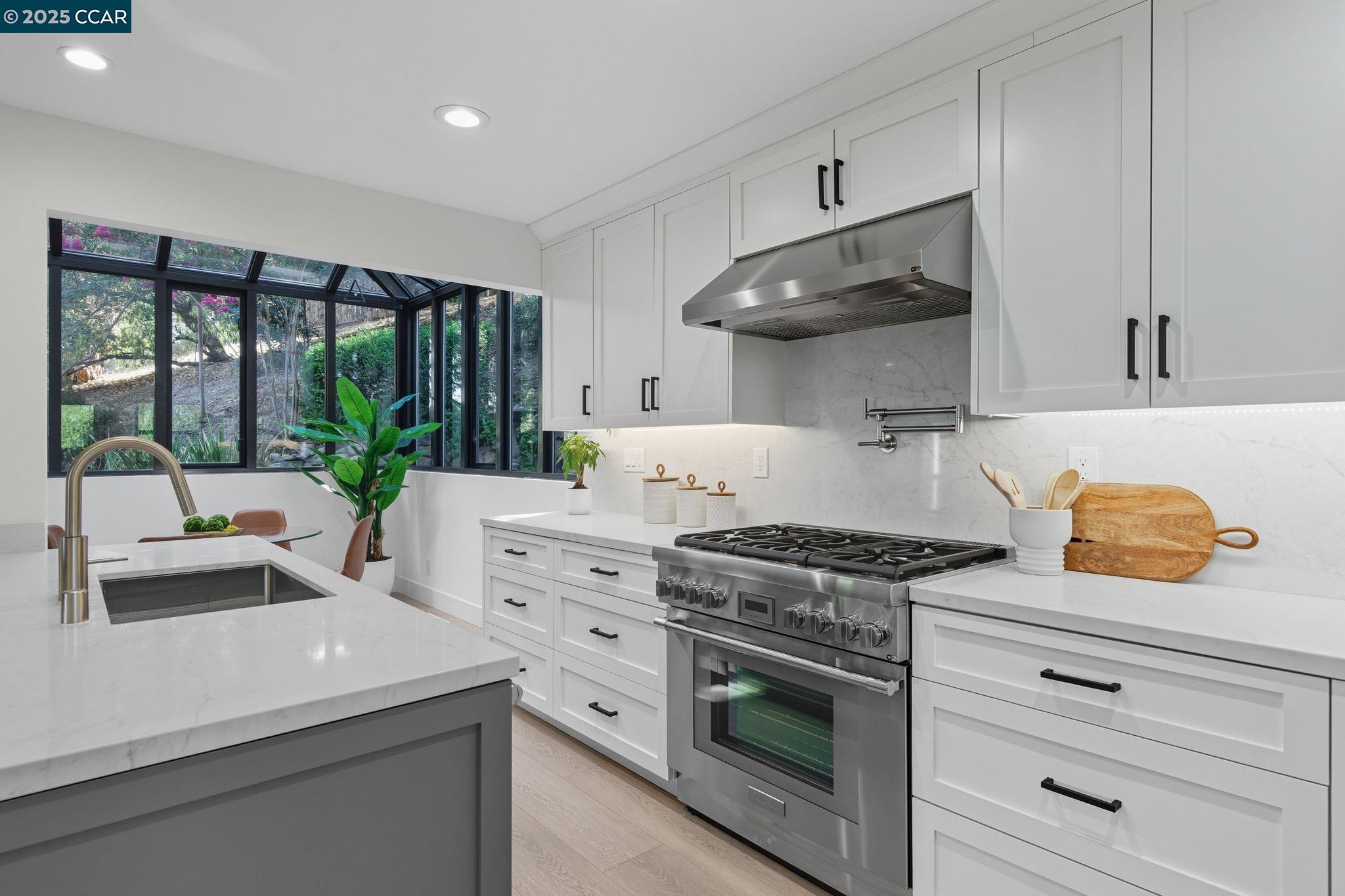 189 Rudgear Drive Walnut Creek, CA 94596 - Photo 58 of 59 a kitchen with stainless steel appliances a stove a sink and a refrigerator
