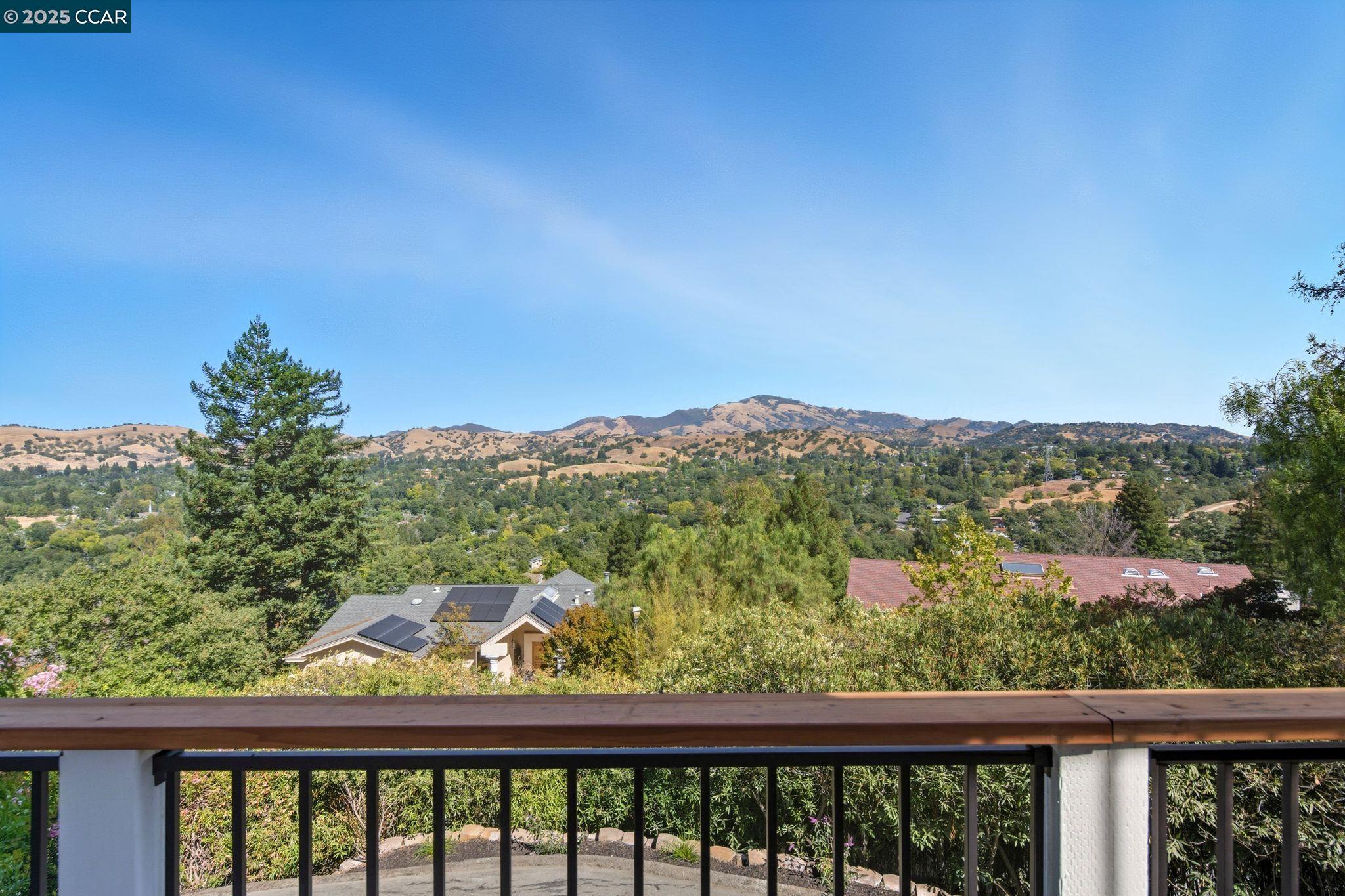 189 Rudgear Drive Walnut Creek, CA 94596 - Photo 9 of 59 a view of a balcony with wooden fence and floor