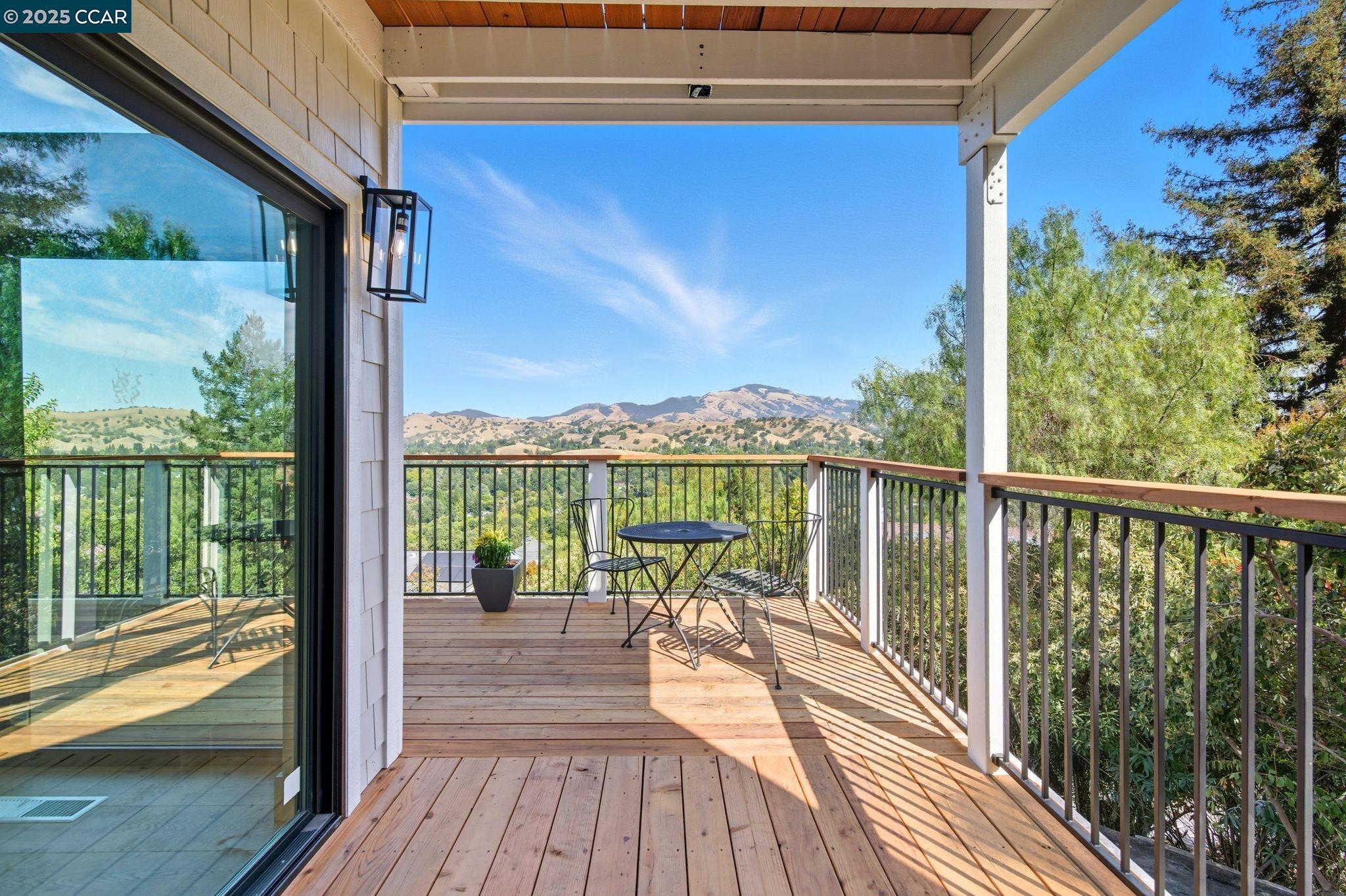 189 Rudgear Drive Walnut Creek, CA 94596 - Photo 10 of 59 a view of a balcony with floor to ceiling windows wooden floor