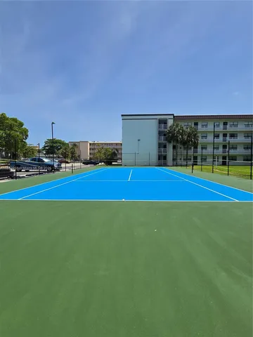 a view of outdoor space with playground and green space