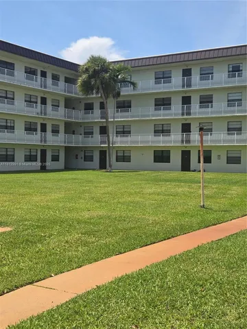 a view of building with yard