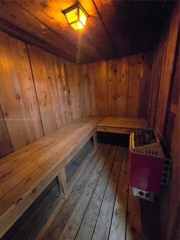 a wooden bench sitting in wooden floor