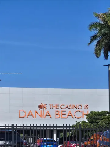 a view of a garden with a building in the background