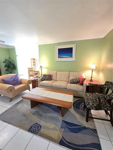 a living room with furniture and a lamp